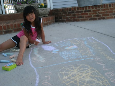 Kasen drawing with sidewalk chalk